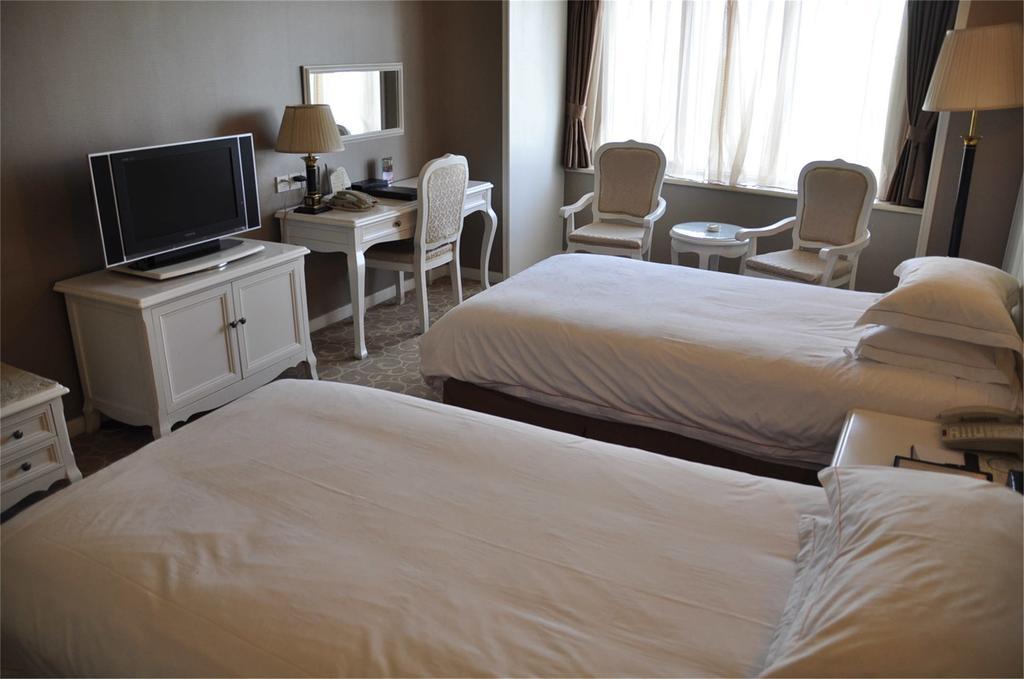 Geneva Hotel Тяньцзинь Номер фото