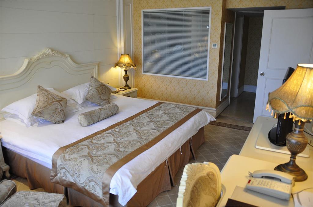 Geneva Hotel Тяньцзинь Номер фото